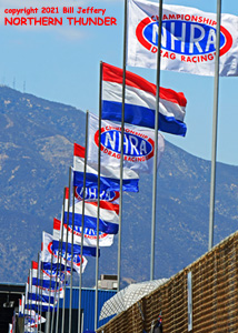 NHRA Flags flying over Auto Club Raceway